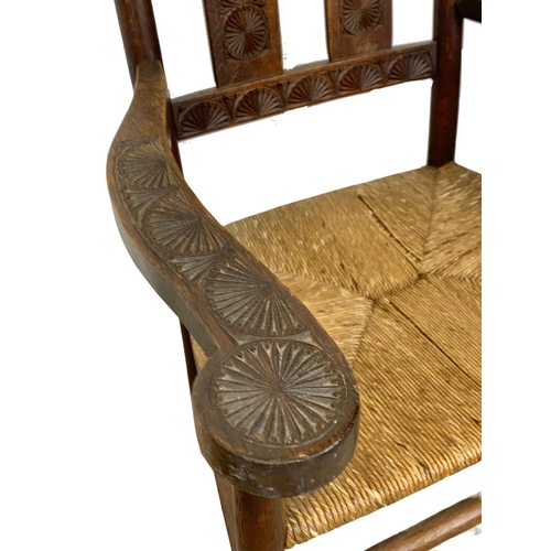 811 - A pair of Edwardian oak country armchairs with Aesthetic Movement influence