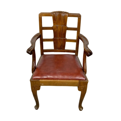 812 - A 1930s armchair with leather seat