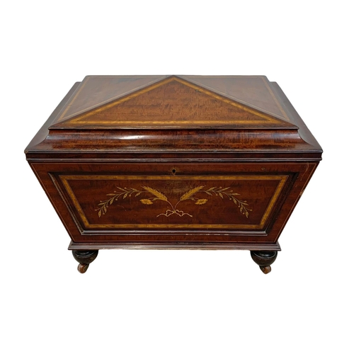 813 - A 19th century inlaid mahogany wine cooler in the sarcophagus shape and Sheraton style circa 1870s. ... 