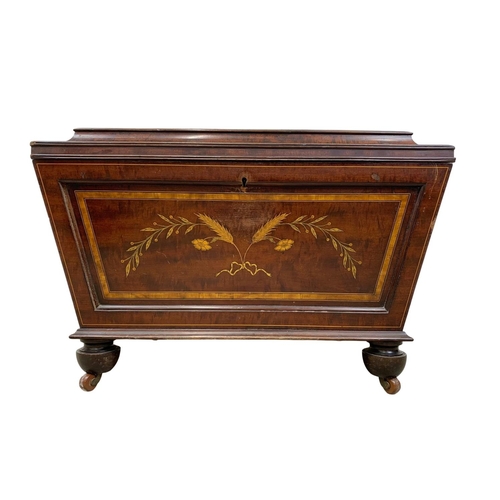 813 - A 19th century inlaid mahogany wine cooler in the sarcophagus shape and Sheraton style circa 1870s. ... 