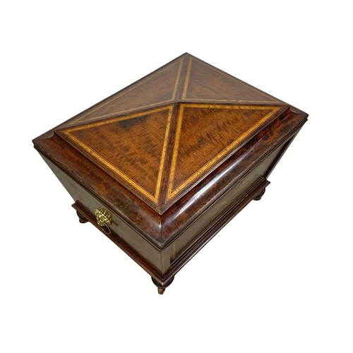 813 - A 19th century inlaid mahogany wine cooler in the sarcophagus shape and Sheraton style circa 1870s. ... 