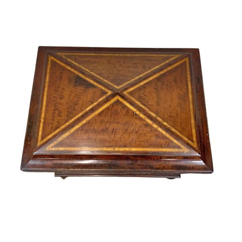 813 - A 19th century inlaid mahogany wine cooler in the sarcophagus shape and Sheraton style circa 1870s. ... 