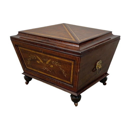 813 - A 19th century inlaid mahogany wine cooler in the sarcophagus shape and Sheraton style circa 1870s. ... 