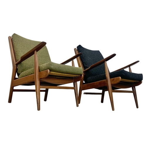 805 - A pair of Danish style teak armchairs by Scandart circa 1960's