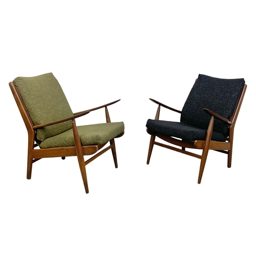 805 - A pair of Danish style teak armchairs by Scandart circa 1960's