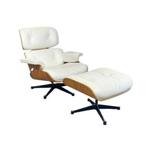 806 - A Charles & Ray Eames style armchair with matching stool