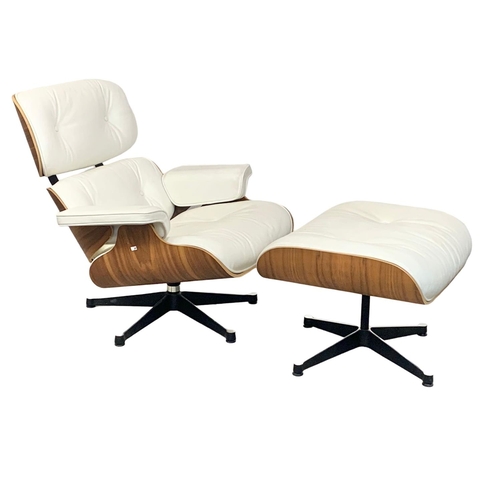 806 - A Charles & Ray Eames style armchair with matching stool