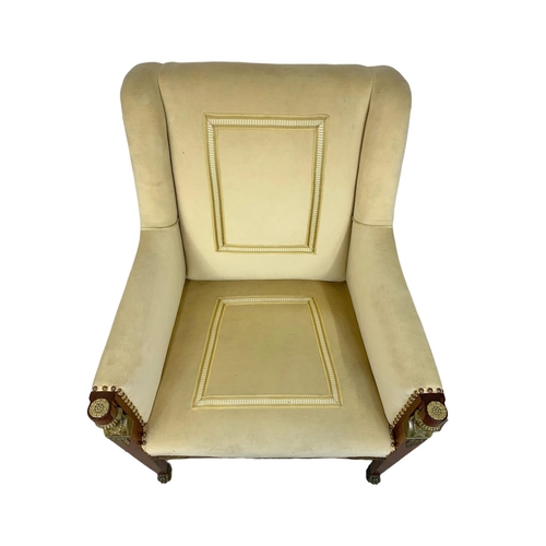 807 - A large Egyptian revival Regency style armchair with brass ormolu mounts