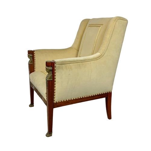 807 - A large Egyptian revival Regency style armchair with brass ormolu mounts