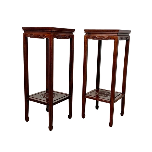 811 - A pair of rosewood Chinese pedestal stands. 80cm