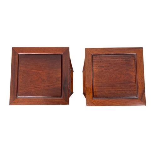 811 - A pair of rosewood Chinese pedestal stands. 80cm