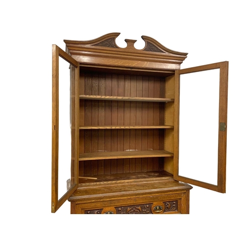 873 - A large Victorian oak secretaire bookcase. 122 x 51.5 x 255cm.