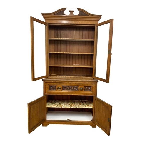 873 - A large Victorian oak secretaire bookcase. 122 x 51.5 x 255cm.