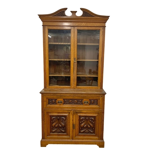 873 - A large Victorian oak secretaire bookcase. 122 x 51.5 x 255cm.