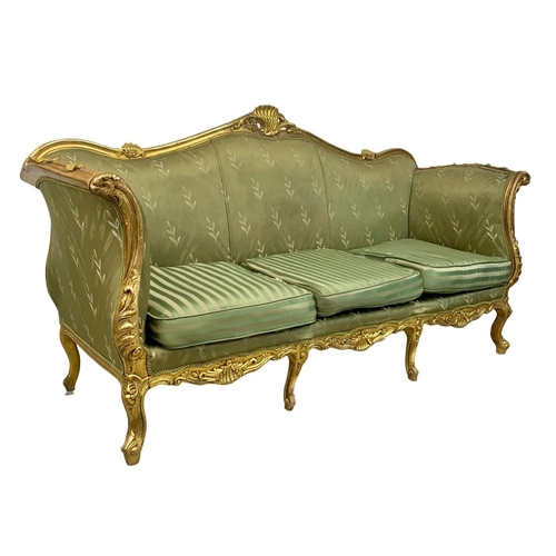 920 - A large vintage 18th century style French gilded chateau couch. 233cm