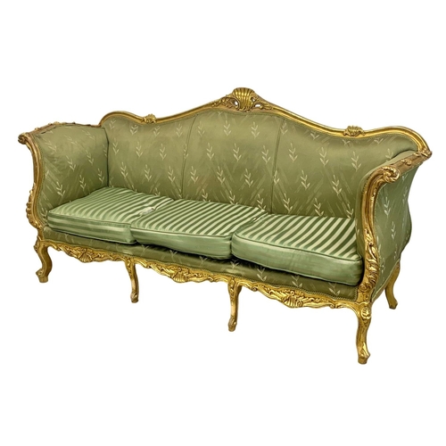 920 - A large vintage 18th century style French gilded chateau couch. 233cm