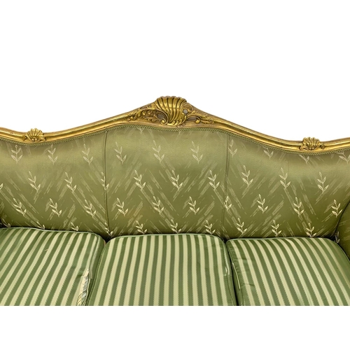 920 - A large vintage 18th century style French gilded chateau couch. 233cm