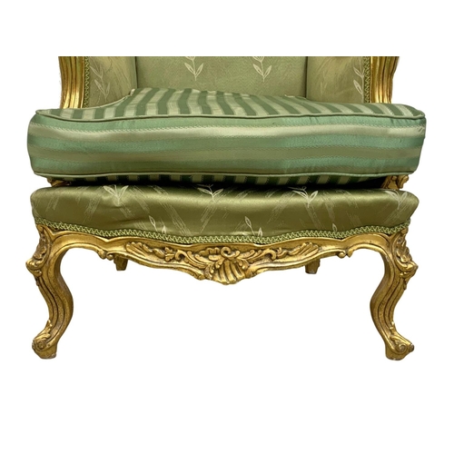 921 - A pair of large vintage 18th century style gilded chateau armchairs.