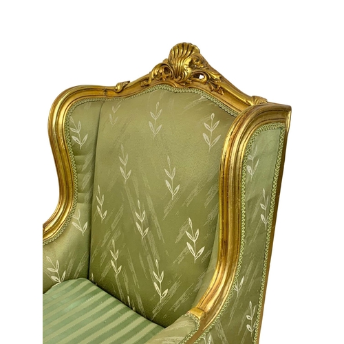 921 - A pair of large vintage 18th century style gilded chateau armchairs.