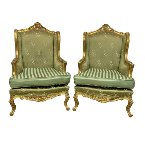 921 - A pair of large vintage 18th century style gilded chateau armchairs.