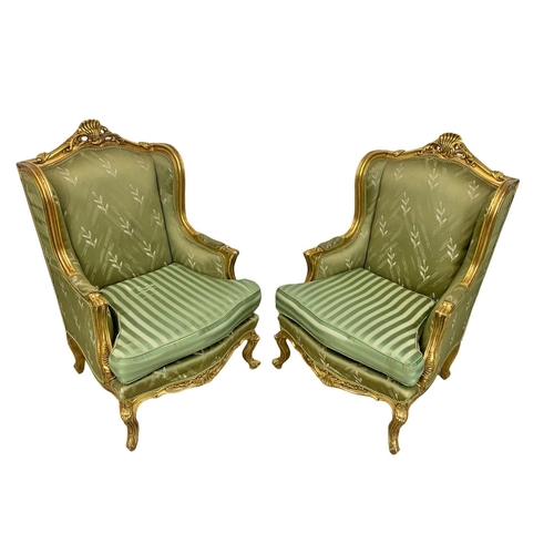 921 - A pair of large vintage 18th century style gilded chateau armchairs.