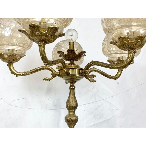 225 - A 1970s brass floor lamp, 136cm