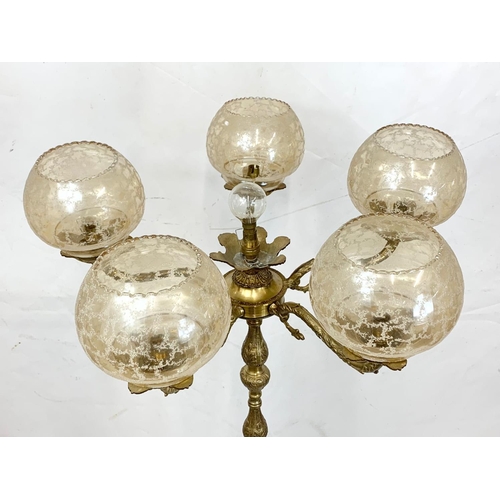 225 - A 1970s brass floor lamp, 136cm