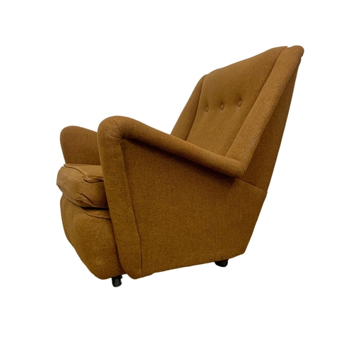 950 - A neat sized Mid Century armchair circa 1960's. 76cm x 85cm x 85cm