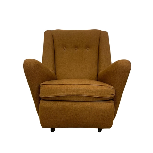 950 - A neat sized Mid Century armchair circa 1960's. 76cm x 85cm x 85cm