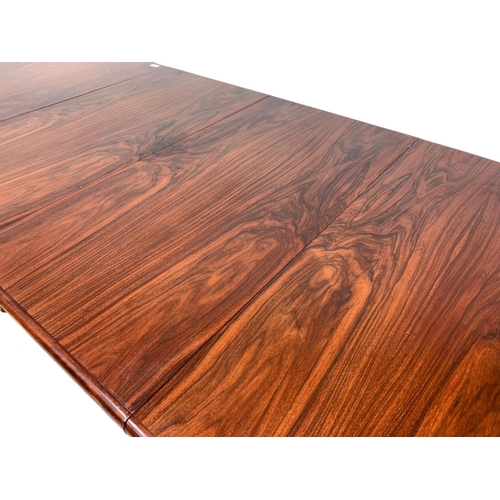 951 - A Danish rosewood two leaf dining table by Rasmus, 150cm x 100cm x 74cm. Not extended