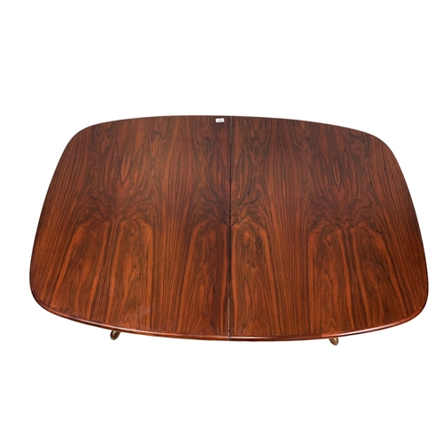 951 - A Danish rosewood two leaf dining table by Rasmus, 150cm x 100cm x 74cm. Not extended