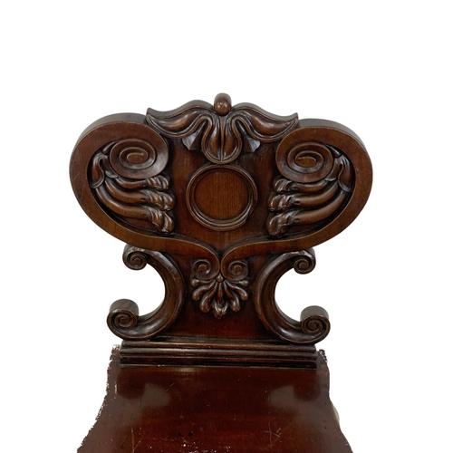 954 - A William IV mahogany hall chair.  Circa 1835.