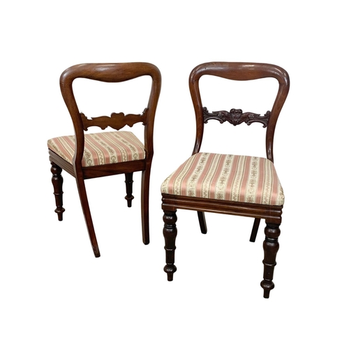 957 - A pair of Victorian balloon back chairs.