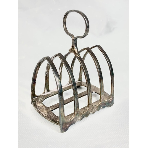 678 - 2 silver napkin rings 93 grams with an EP toast rack