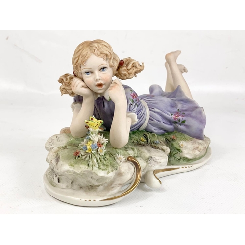 619 - A Vintage Capodimonte figurine, signed Sandro Maggioni 1973. 22x11cm