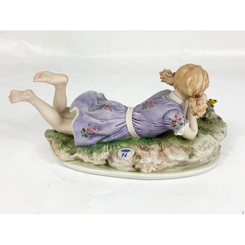 619 - A Vintage Capodimonte figurine, signed Sandro Maggioni 1973. 22x11cm