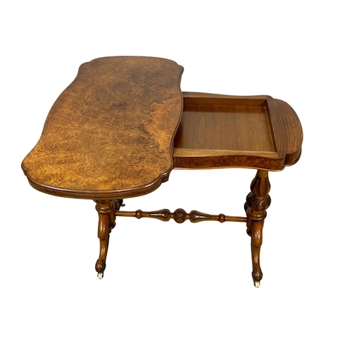 874a - A Victorian burr walnut turnover games table with stretcher. 96.5x51x75cm