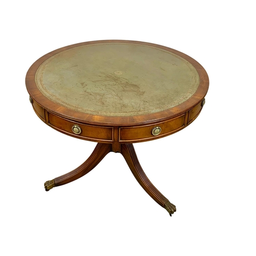 1029E - A Georgian style mahogany drum table with leather top, 90cm x 71cm