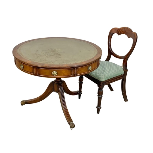 1029E - A Georgian style mahogany drum table with leather top, 90cm x 71cm