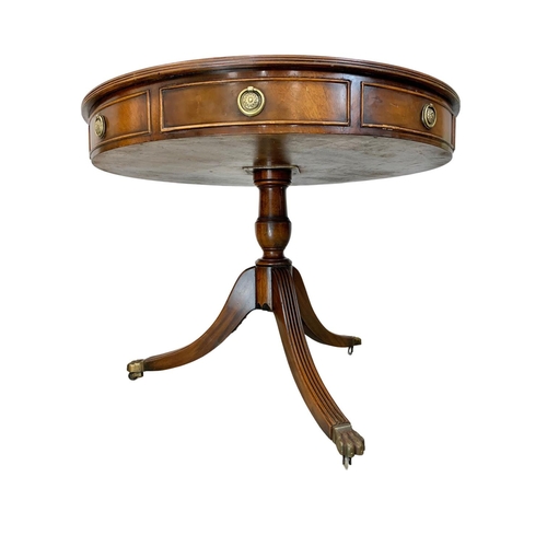 1029E - A Georgian style mahogany drum table with leather top, 90cm x 71cm