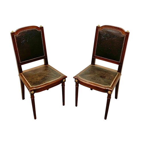 1043 - A pair of 19th century French mahogany side chairs with leather back and seats and brass decoration.... 