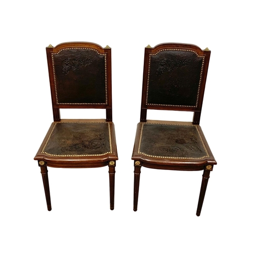 1043 - A pair of 19th century French mahogany side chairs with leather back and seats and brass decoration.... 