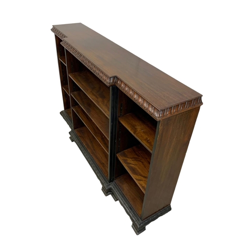 1052 - A large Edwardian break front open bookcase, 181cm x 40cm x 123cm