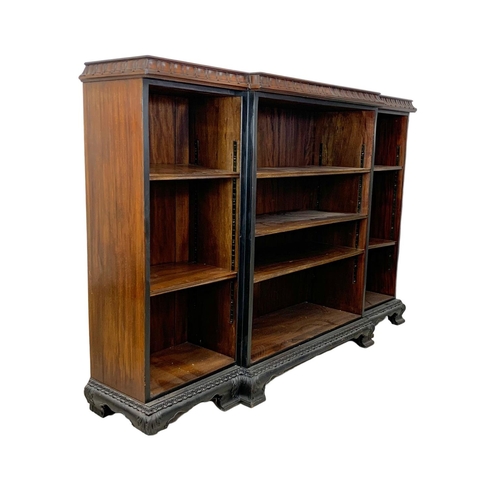 1052 - A large Edwardian break front open bookcase, 181cm x 40cm x 123cm