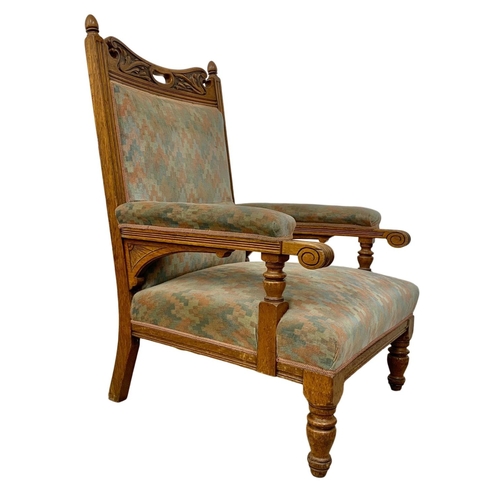 1062 - A pair of large Edwardian oak armchairs.