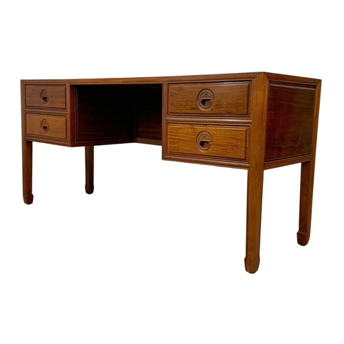 1065 - A large Chinese teak and rosewood desk.  153x49x71cm