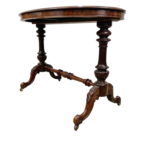 1068 - A Victorian mahogany library table on carved double pedestal base, 105cm x 65 x 75cm