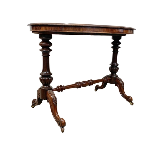 1068 - A Victorian mahogany library table on carved double pedestal base, 105cm x 65 x 75cm