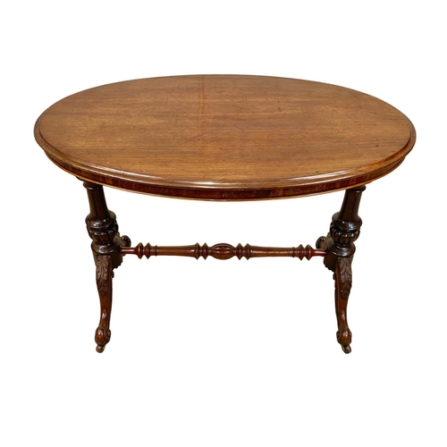 1068 - A Victorian mahogany library table on carved double pedestal base, 105cm x 65 x 75cm