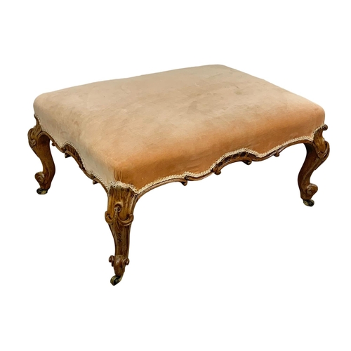 1074 - A large Victorian country house stool in walnut and on Cabriole legs, 90cm x 63cm